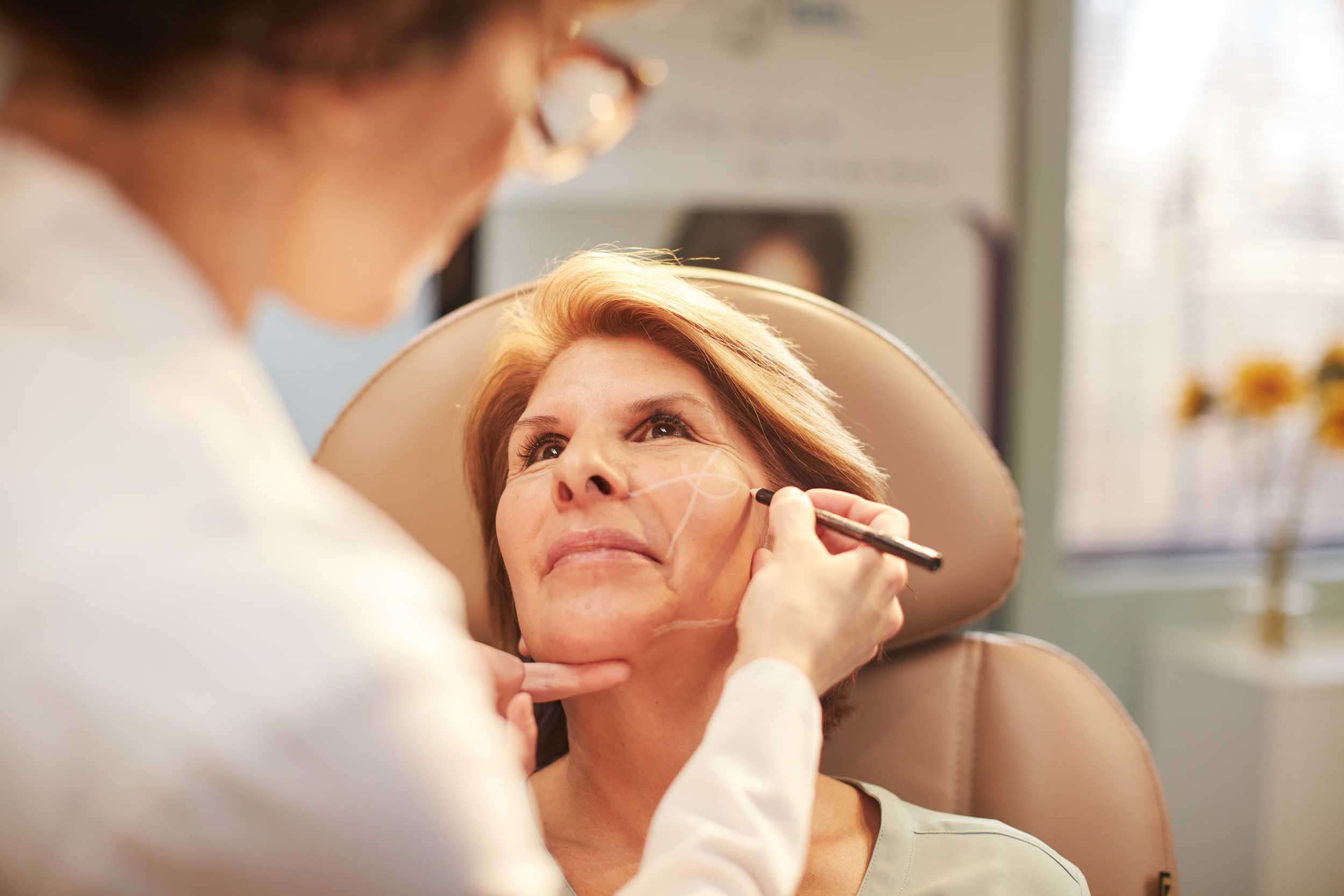 An Aesthetician Prepping Her Patient